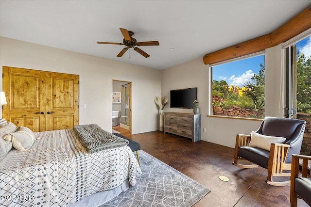 bedroom with ceiling fan and connected bathroom