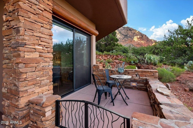 view of patio / terrace with a mountain view