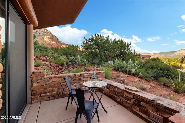 view of patio / terrace with a mountain view