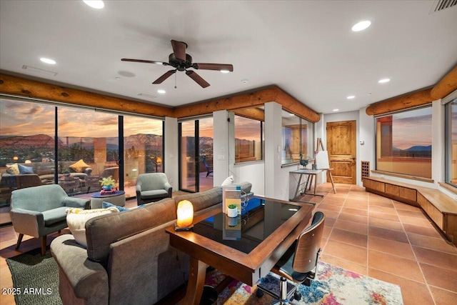 living room featuring ceiling fan and light tile patterned floors