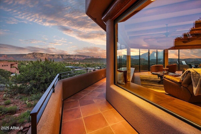 balcony at dusk with a mountain view