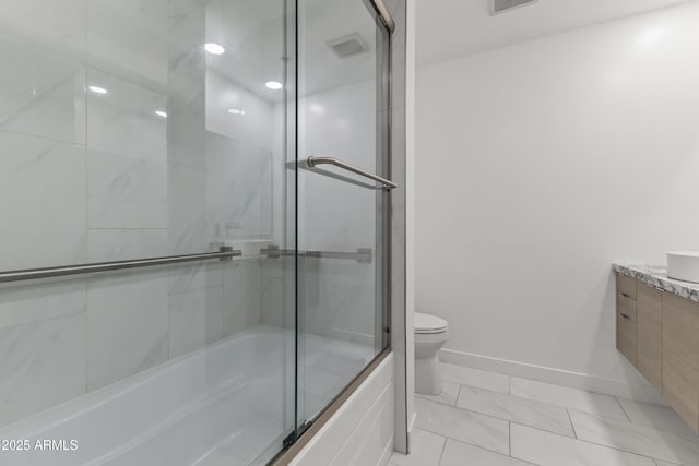 full bath with toilet, marble finish floor, shower / bath combination with glass door, baseboards, and vanity