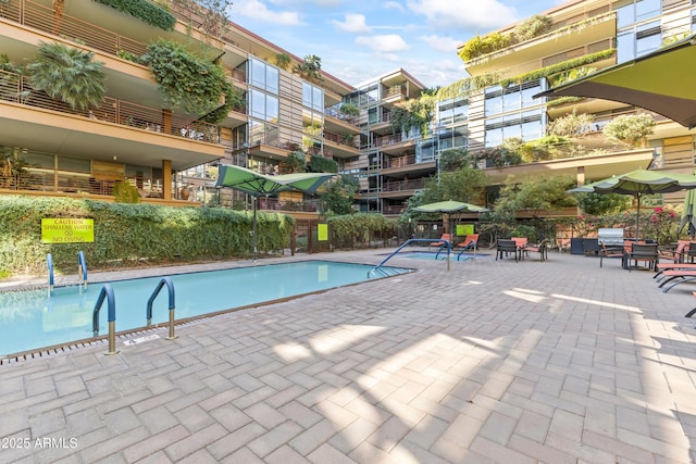 community pool with a patio area