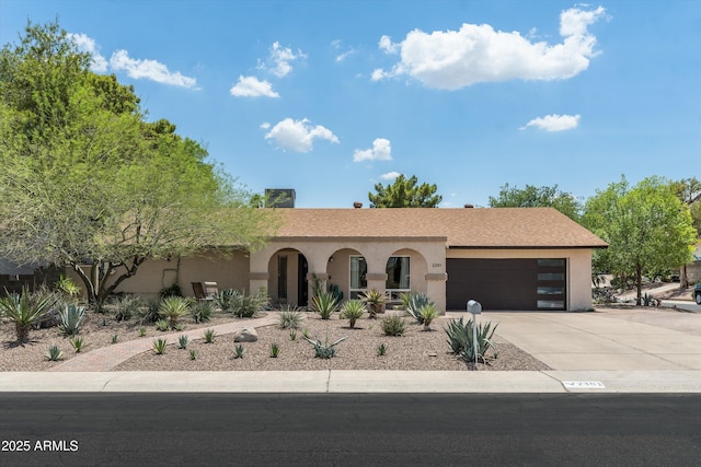 2301 E Sunnyside Dr, Phoenix, AZ 85028 - ranch-style home featuring driveway, an attached garage, and stucco siding
