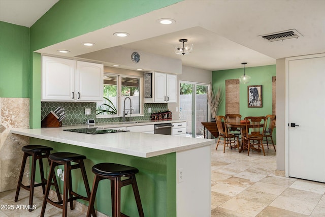2301 E Sunnyside Dr, Phoenix, AZ 85028 - kitchen with a sink, decorative backsplash, a peninsula, white cabinetry, and dishwasher
