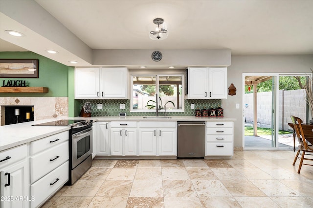 2301 E Sunnyside Dr, Phoenix, AZ 85028 - kitchen with stainless steel appliances, plenty of natural light, tasteful backsplash, a sink, and recessed lighting