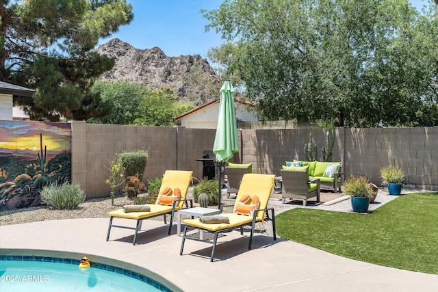 2301 E Sunnyside Dr, Phoenix, AZ 85028 - view of swimming pool featuring a mountain view, a patio area, and an outdoor living space