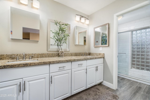 2301 E Sunnyside Dr, Phoenix, AZ 85028 - full bath featuring double vanity, a tile shower, and wood finished floors