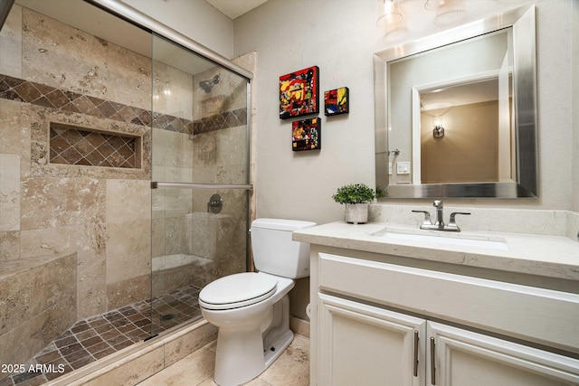 2301 E Sunnyside Dr, Phoenix, AZ 85028 - bathroom featuring toilet, vanity, a shower stall, and tile patterned flooring