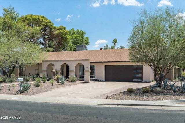 2301 E Sunnyside Dr, Phoenix, AZ 85028 - view of front of house with a garage, driveway, and stucco siding