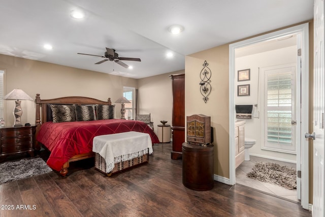 bedroom featuring recessed lighting, ensuite bathroom, ceiling fan, wood finished floors, and baseboards