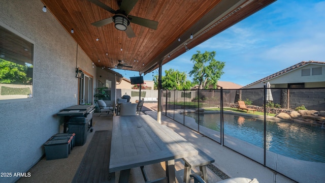 view of patio / terrace with a ceiling fan and fence