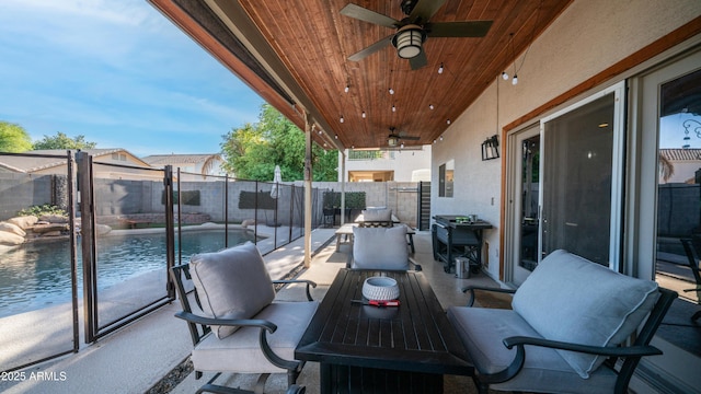 view of patio / terrace with a ceiling fan and a fenced backyard