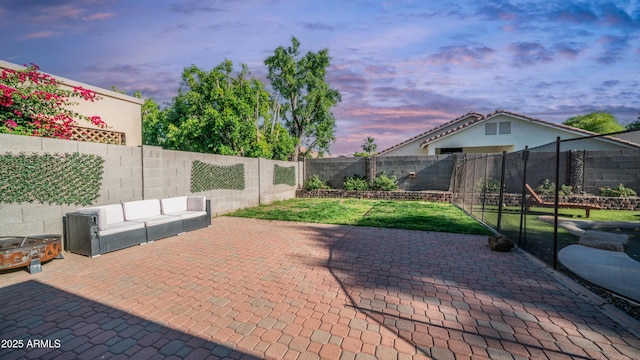 view of patio featuring a fenced backyard and an outdoor living space