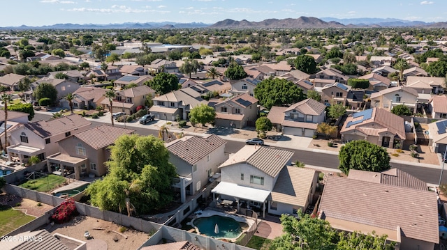 aerial perspective of suburban area featuring a mountainous background