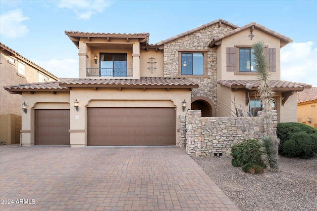 mediterranean / spanish-style house featuring a garage