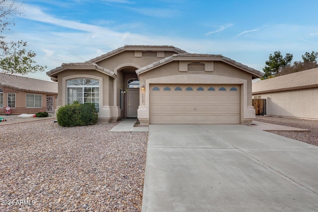 ranch-style home featuring a garage