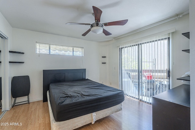 2228 N 52nd St Unit 213, Phoenix, AZ 85008 - bedroom featuring access to outside, light wood-style flooring, and a ceiling fan