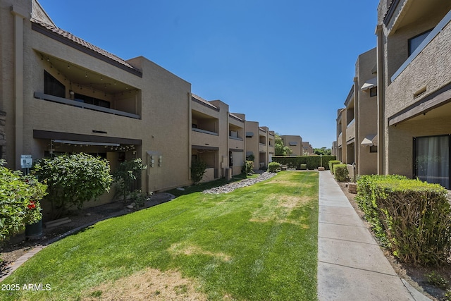 2228 N 52nd St Unit 213, Phoenix, AZ 85008 - view of property's community featuring a residential view and a yard