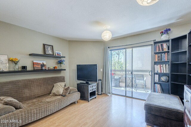 2228 N 52nd St Unit 213, Phoenix, AZ 85008 - living room with wood finished floors