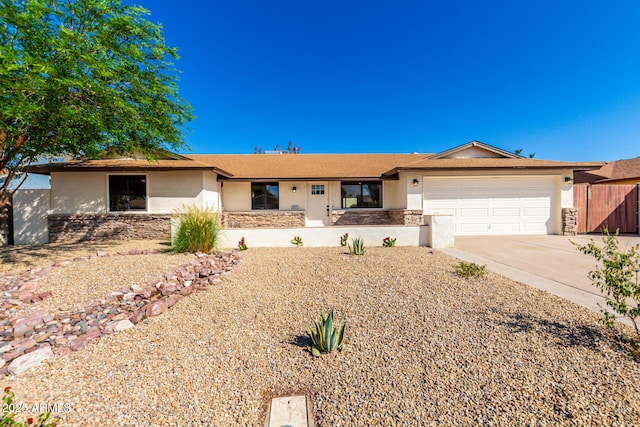 1611 W Palomino Dr, Chandler, AZ 85224 - single story home with stone siding, concrete driveway, stucco siding, and an attached garage