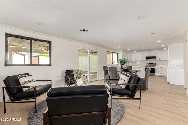 1611 W Palomino Dr, Chandler, AZ 85224 - living room with ornamental molding, light wood-style floors, and recessed lighting