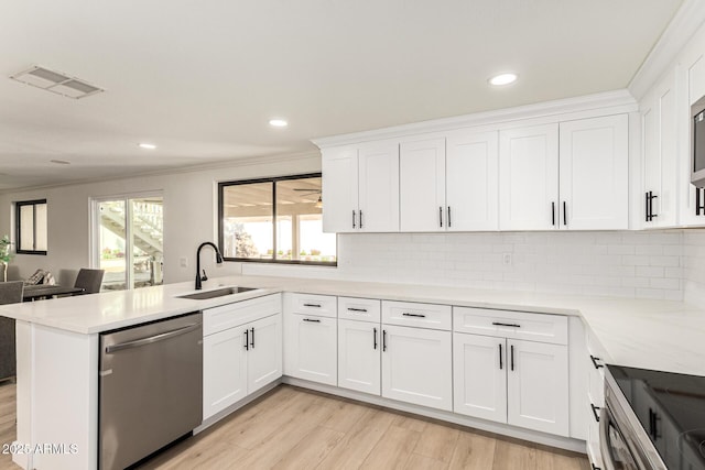1611 W Palomino Dr, Chandler, AZ 85224 - kitchen featuring stainless steel dishwasher, light wood-style flooring, healthy amount of natural light, white cabinets, and recessed lighting