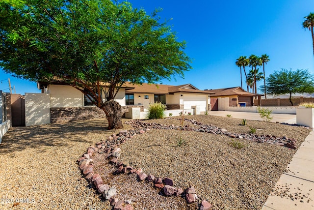 1611 W Palomino Dr, Chandler, AZ 85224 - ranch-style home featuring a garage, stucco siding, and driveway
