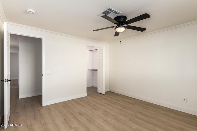 1611 W Palomino Dr, Chandler, AZ 85224 - unfurnished bedroom with ornamental molding, light wood-style flooring, a ceiling fan, and a closet