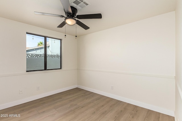 1611 W Palomino Dr, Chandler, AZ 85224 - empty room with wood finished floors and ceiling fan
