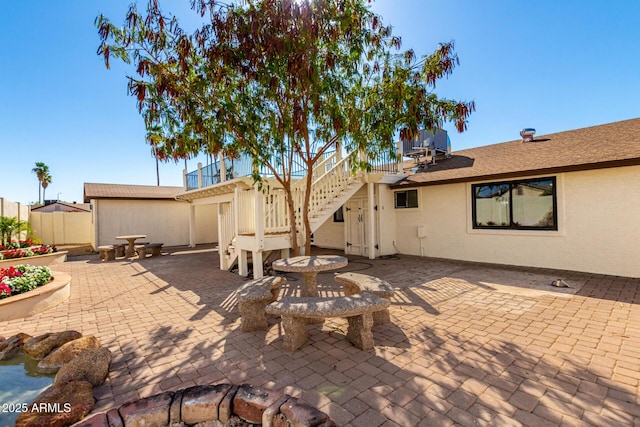 1611 W Palomino Dr, Chandler, AZ 85224 - back of house with a patio area, stairway, and stucco siding
