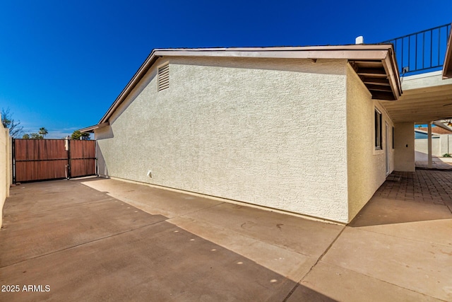 1611 W Palomino Dr, Chandler, AZ 85224 - view of side of property with stucco siding and a patio area