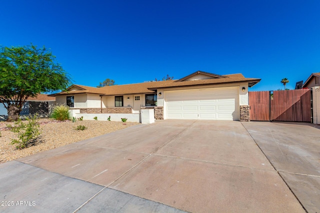 1611 W Palomino Dr, Chandler, AZ 85224 - ranch-style home featuring stucco siding, a garage, driveway, and stone siding