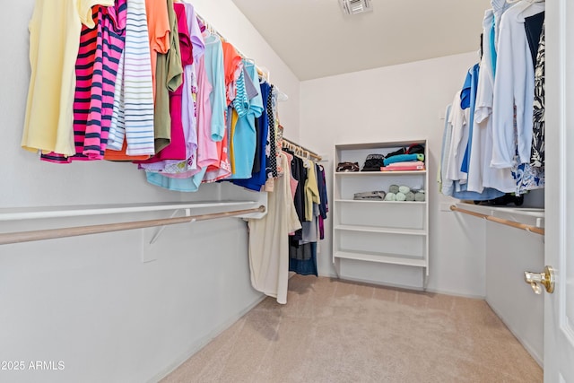 walk in closet with carpet and visible vents