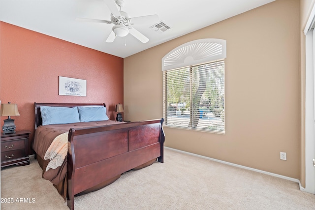 bedroom featuring ceiling fan, carpet flooring, visible vents, and baseboards