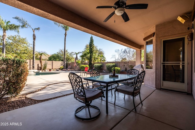 view of patio with a fenced backyard, ceiling fan, a fenced in pool, and outdoor dining space