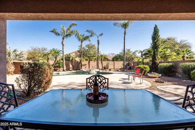 view of swimming pool with a fenced in pool, a fenced backyard, and a patio