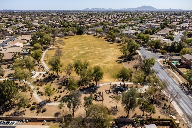 drone / aerial view featuring a residential view and a mountain view