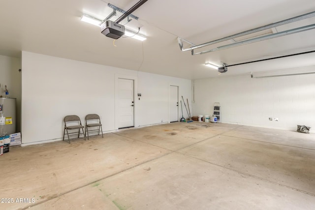 garage featuring a garage door opener and electric water heater