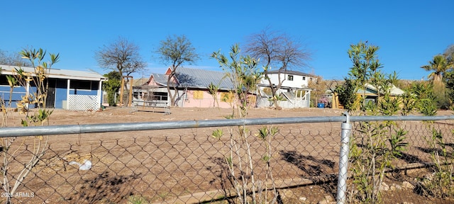 view of front of property featuring fence