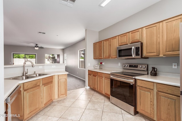 kitchen featuring a sink, visible vents, stainless steel appliances, and light countertops