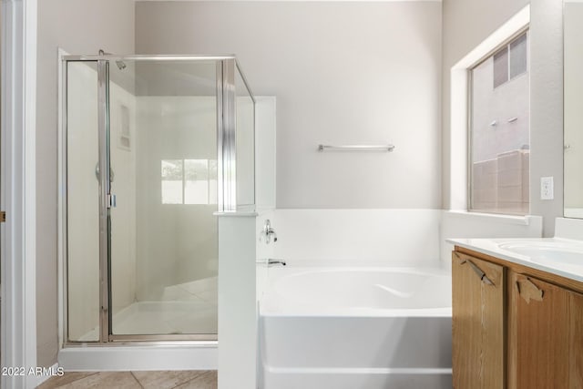 full bathroom with tile patterned flooring, a garden tub, vanity, and a shower stall