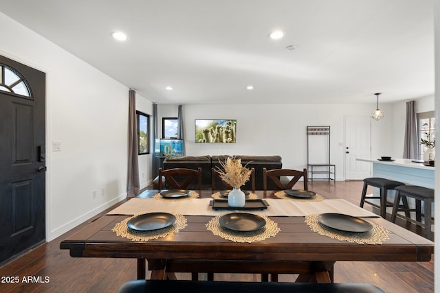 dining area with plenty of natural light, baseboards, wood finished floors, and recessed lighting