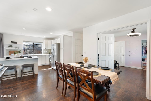 dining area featuring baseboards, recessed lighting, and dark wood-type flooring