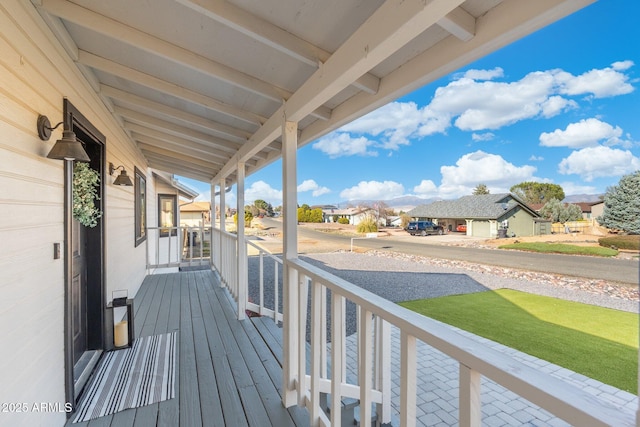 wooden deck with a residential view