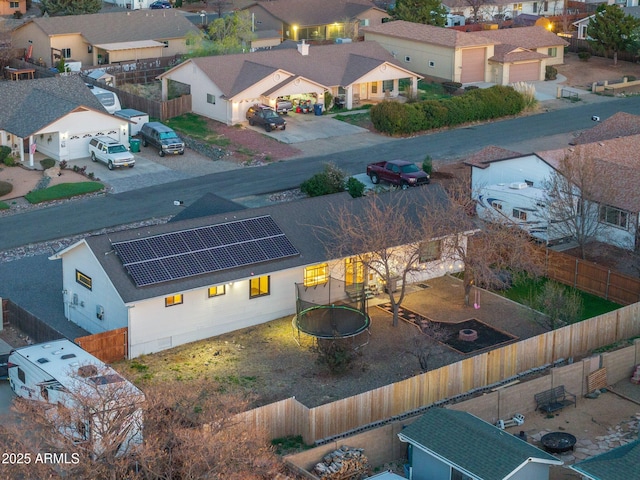 birds eye view of property with a residential view