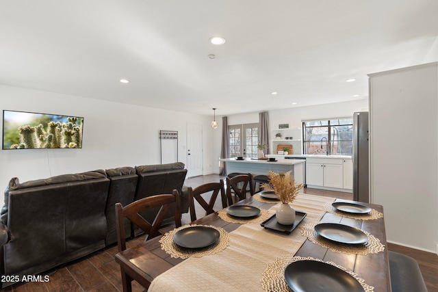 dining room featuring wood finished floors and recessed lighting