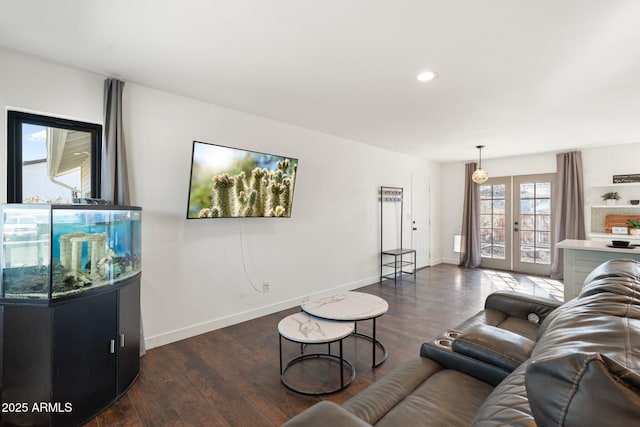 living room with french doors, recessed lighting, baseboards, and wood finished floors