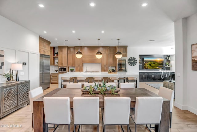 dining space with light wood-type flooring