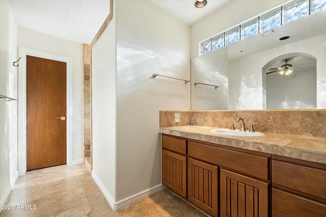 bathroom featuring ceiling fan and vanity